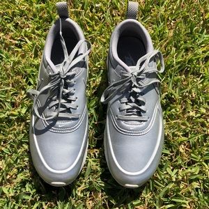 Silver Nike shoes - never worn outside. Size 7.5
